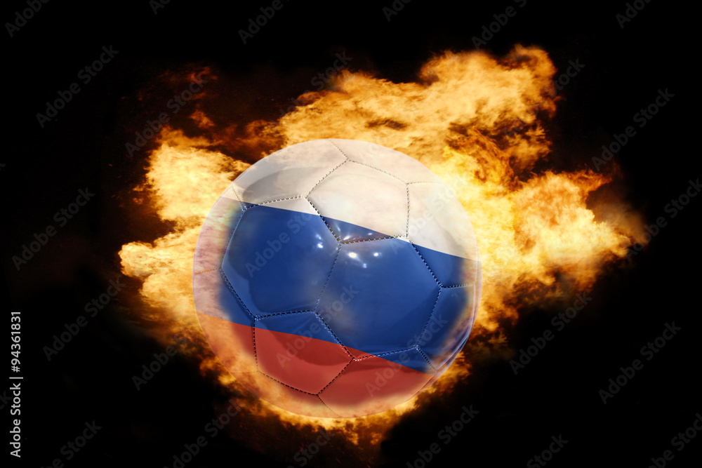 Fototapeta premium football ball with the flag of russia on fire