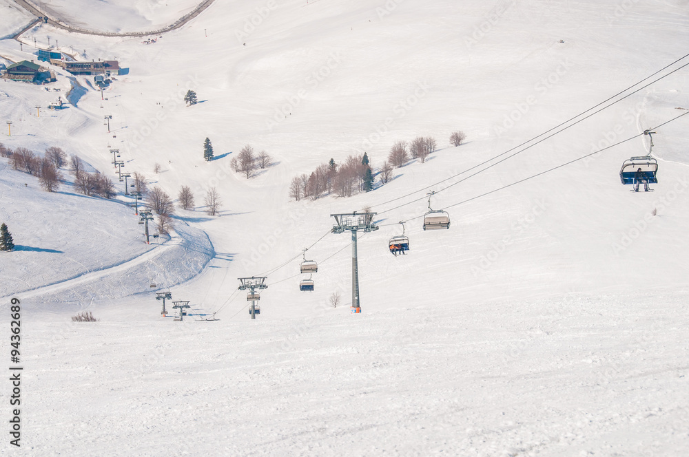 Ski lifts durings bright winter day Ski lifts durings bright winter day