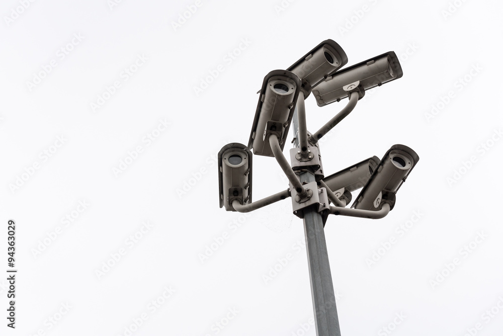 Security cctv surveillance camera in front of blue sky Security cctv surveillance camera in front of blue sky