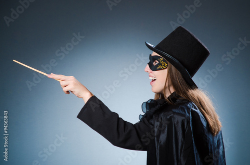 Woman magician in funny concept