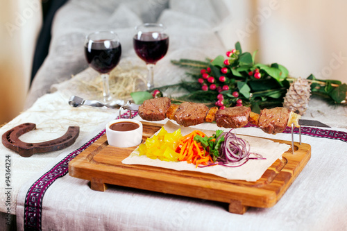 meat skewers wooden board still life in a Christmas New Year holiday meal wine