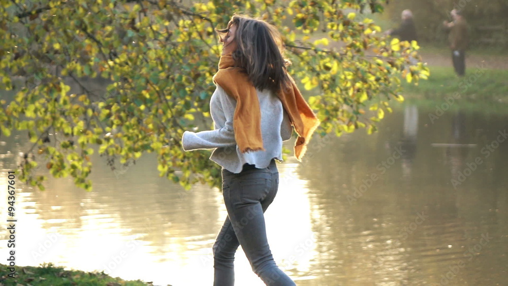 Afraid, scared woman running away in park, slow motion shot at 240fps