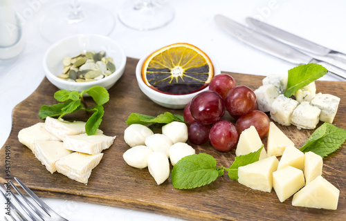 cheese plate with a large decorated the assortment of mint