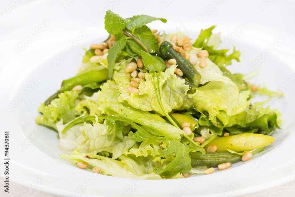 vegetable salad with asparagus on a table in a restaurant vegetable salad with asparagus on a table in a restaurant