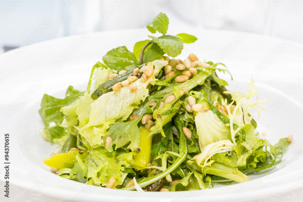 vegetable salad with asparagus on a table in a restaurant vegetable salad with asparagus on a table in a restaurant