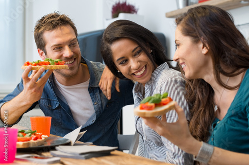 Friends eating bruschetta photo