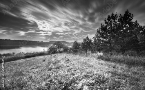 Long exposure landscape with lake at autumn.