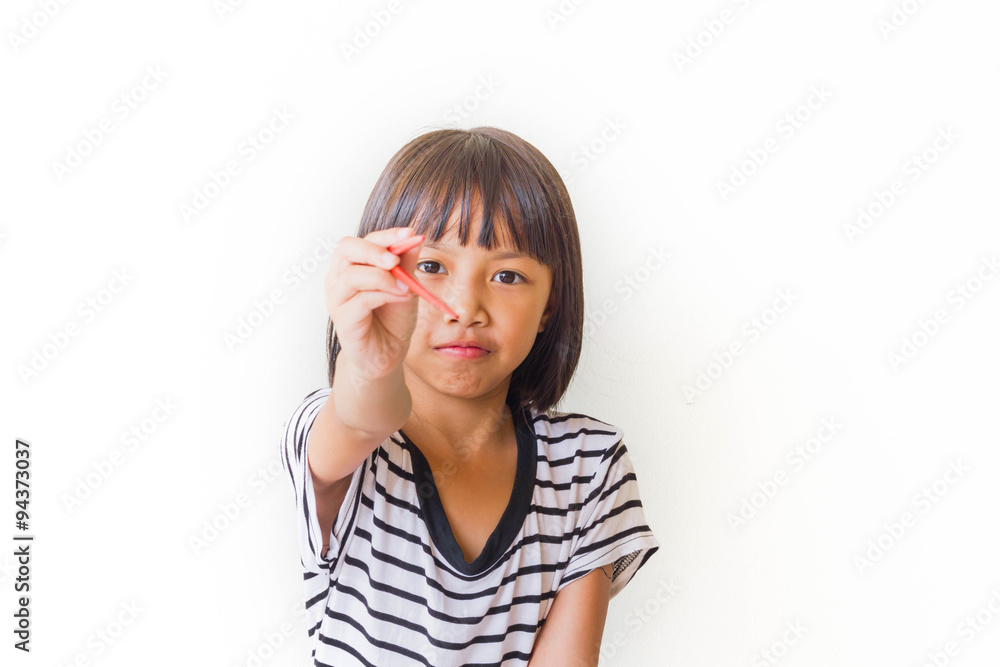Joyful children girl with red chopsticks sitting at the table Joyful children girl with red chopsticks sitting at the table