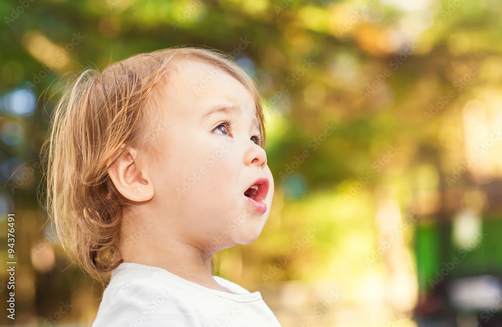 Portrait of a happy toddler girl outside Portrait of a happy toddler girl outside