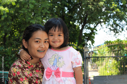 Daughter hugging her neck Smiling happily, mother - child.