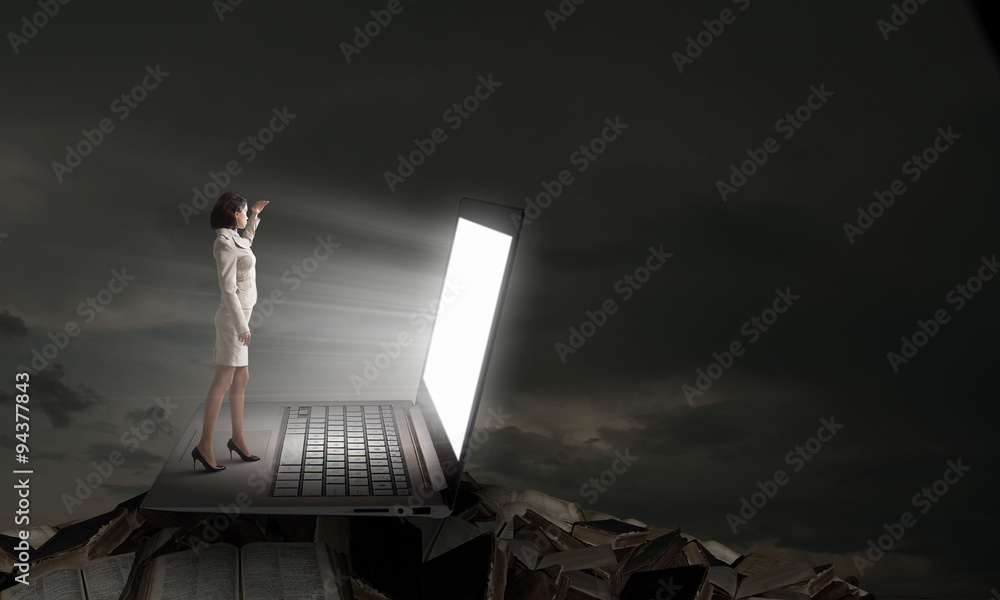 Fototapeta premium Woman in light of laptop screen