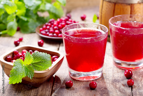 glass of cranberry juice with fresh berries photo