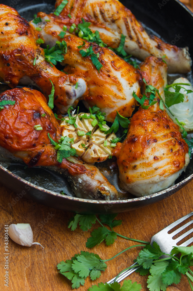 fried chicken drumsticks in a frying pan fried chicken drumsticks in a frying pan