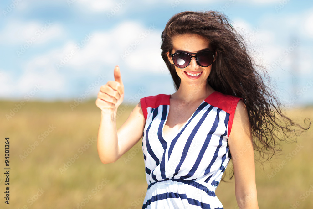 Happy young woman smiling to the camera Happy young woman smiling to the camera