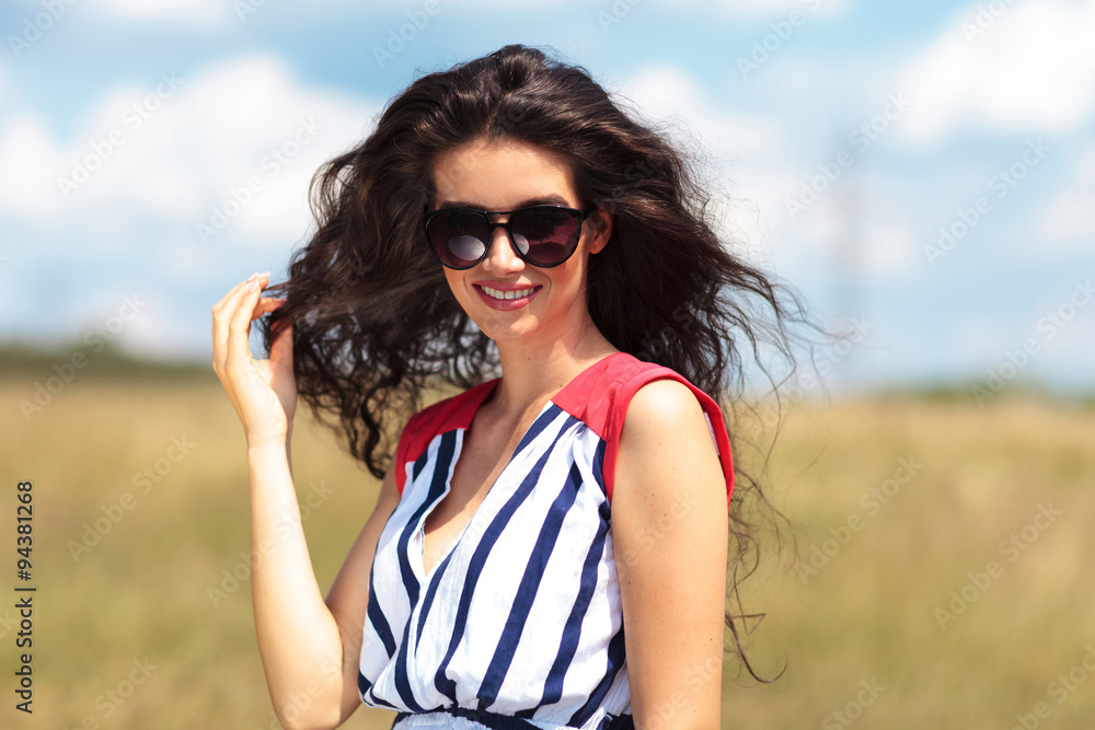 Gorgeous young woman pulling her hair Gorgeous young woman pulling her hair