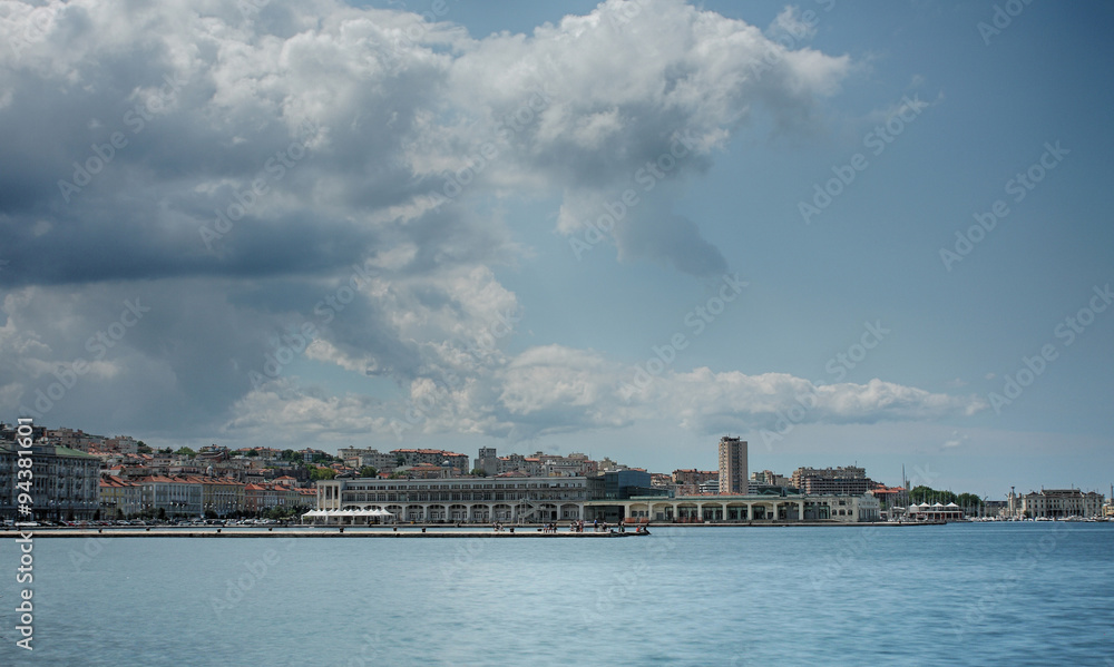 Fototapeta premium Harbor in Trieste, Italy in summer cloudy day