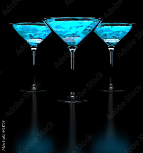 Alcohol. Black mirrored background with a beautiful blue color of the alcohol.
