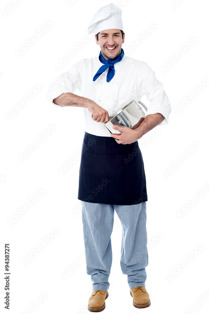 Isolated chef posing with utensil Isolated chef posing with utensil