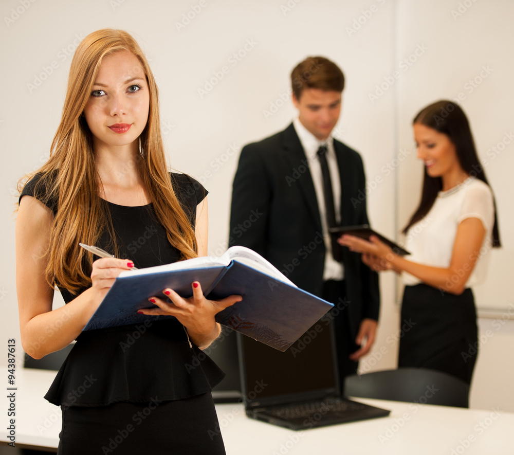 Business woman - secretarry  standing in first plain with cowork