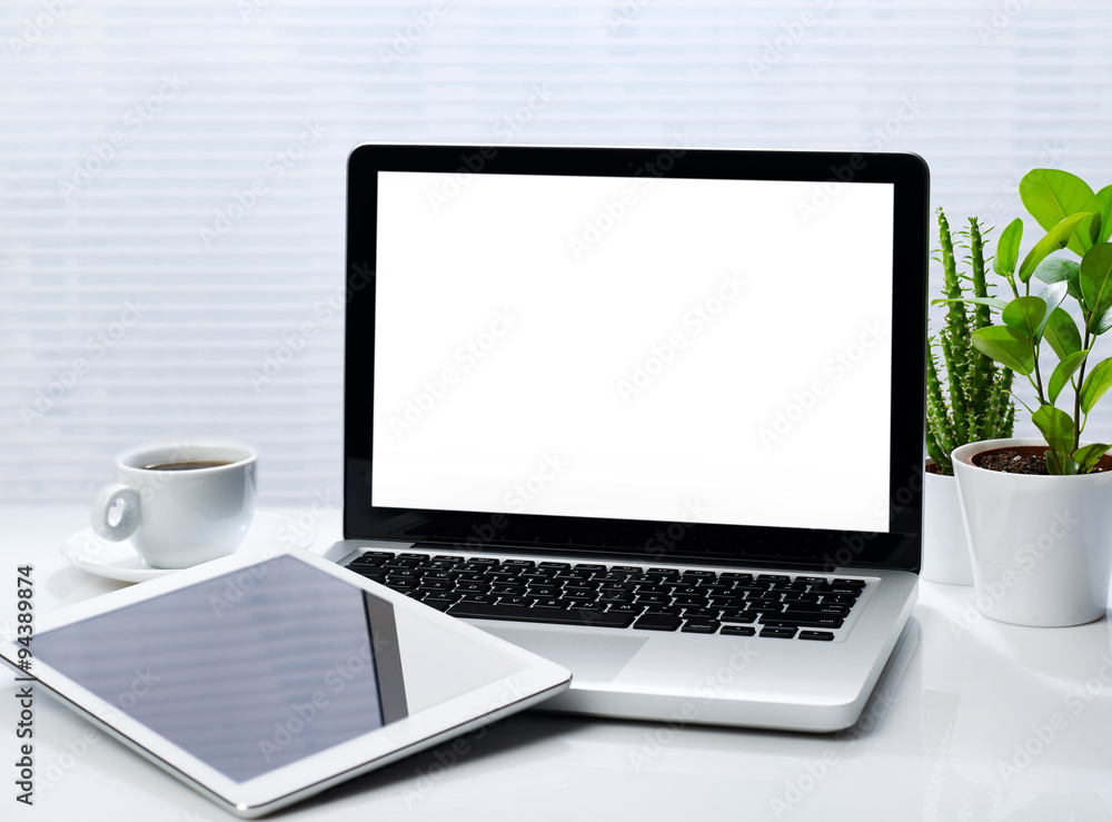 Office desk with laptop and tablet Office desk with laptop and tablet