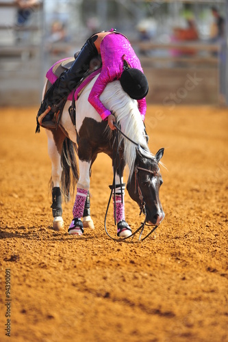 The rider hugging her horse in thanks for successful performance in competitions