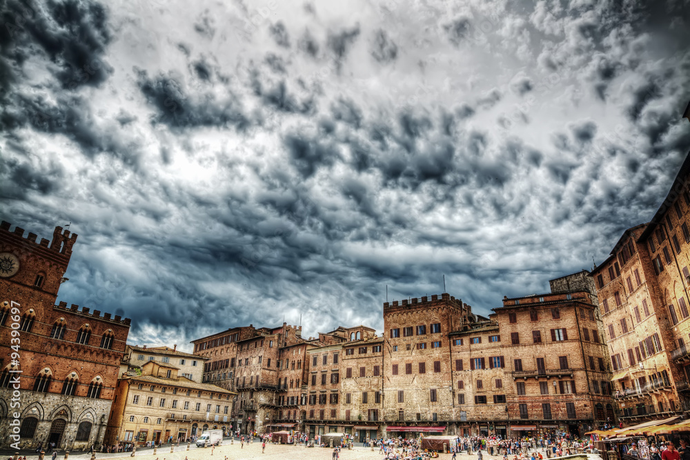 Piazza del Campo in Siena under a dramatic sky in hdr