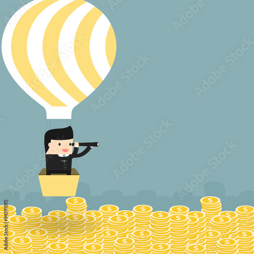 Business situation. Businessman flying in a balloon.