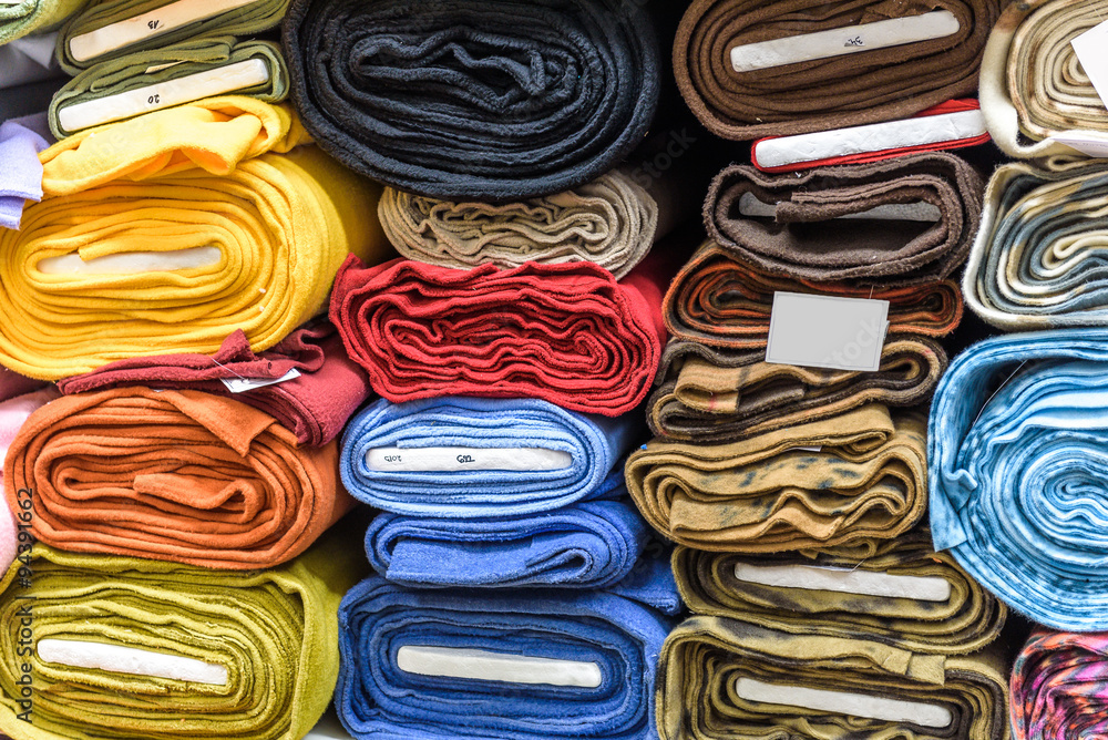 Rolls of fabric and textiles in a factory shop or  store