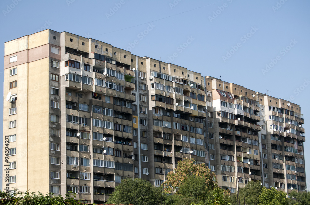 Large obsolete residential apartment block in a poor neighborhood