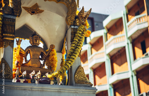Phra Phrom altar in Bangkok street. Phra Phrom is the Thai repre photo
