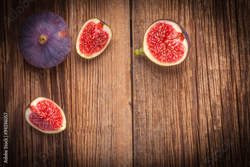Sliced figs on a wooden table.