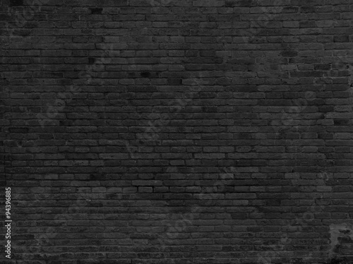 Part of black painted brick wall. Horizontal