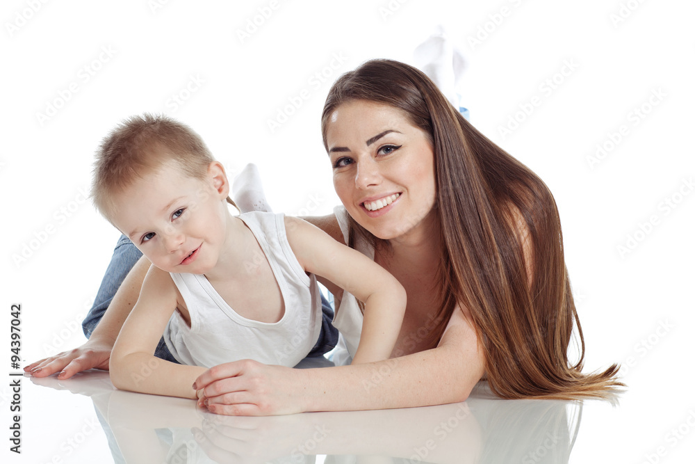 Happy mother are playing with her son in studio, white background Happy mother are playing with her son in studio, white background