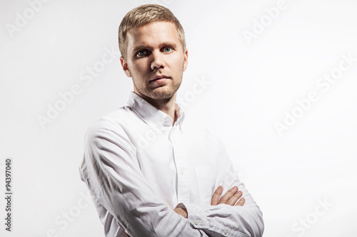 Portrait of a serious man in a white shirt