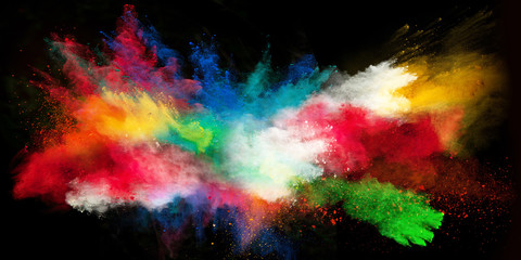 Launched colorful powder on black background