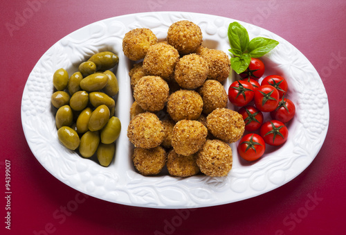 Healthy Italian Appetizer with Risotto Balls Arancini , green Ol
