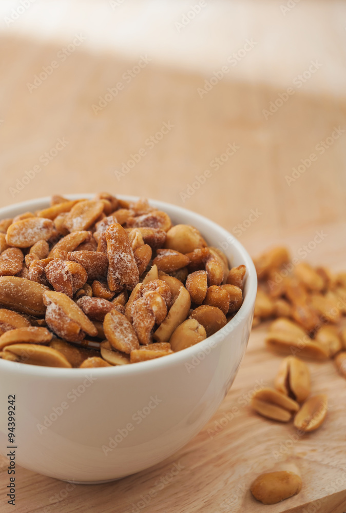 Peas in a white bowl on wooden background Peas in a white bowl on wooden background