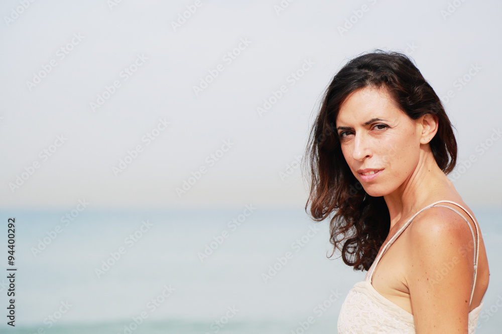 beautiful 35 years old woman standing on the shore of the beach beautiful 35 years old woman standing on the shore of the beach