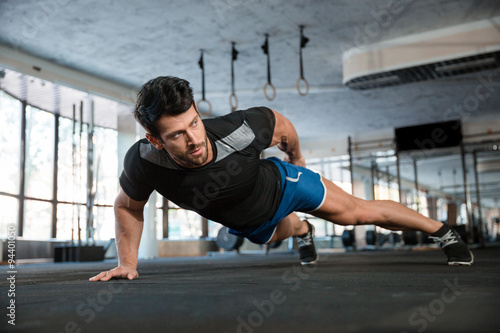 Handsome man doing push ups exercise