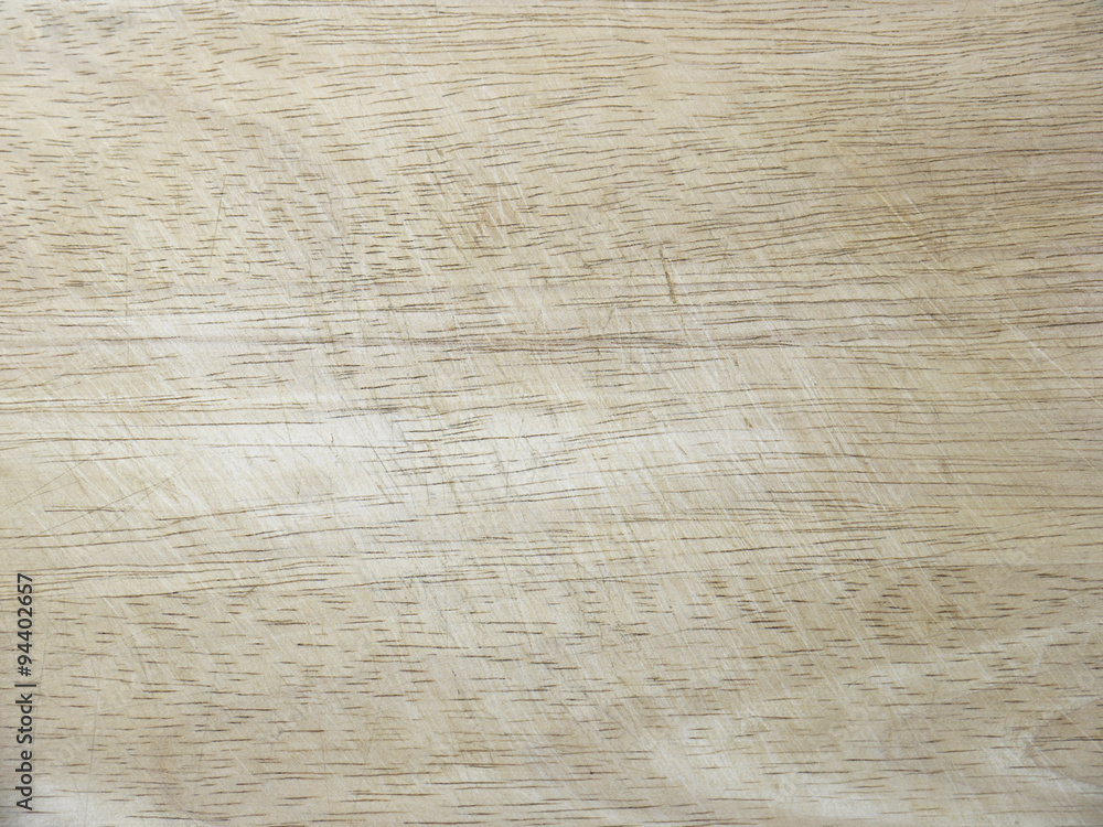 Fototapeta premium Old and used natural wooden cooking board with cuts