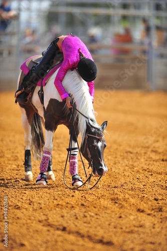 The rider hugs her horse in thanks for the hard work in the competition