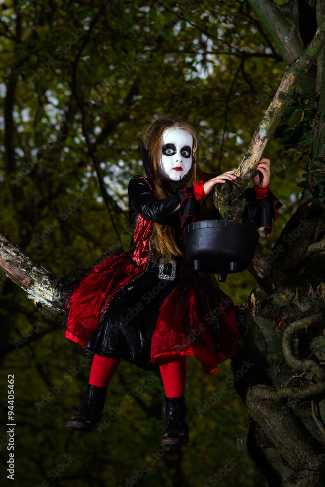 Cute little girl dressed in Halloween costume Cute little girl dressed in Halloween costume