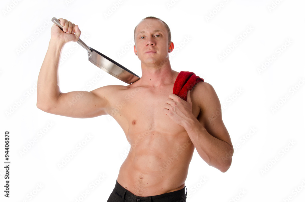Fototapeta premium Young attractive guy. Sexy chef on a white background. Handsome man preparing food.