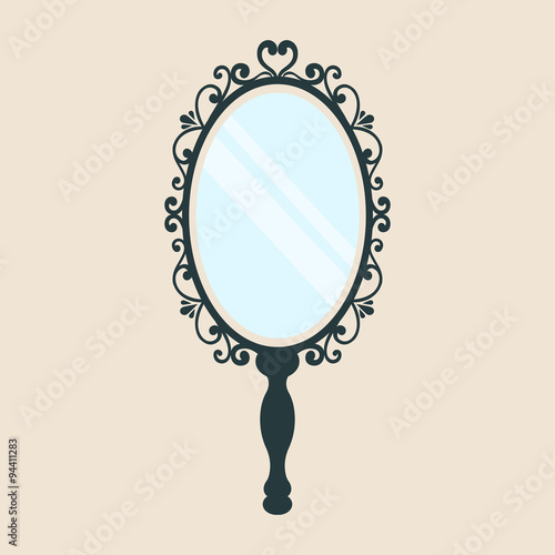 vintage mirror with a handleon a background