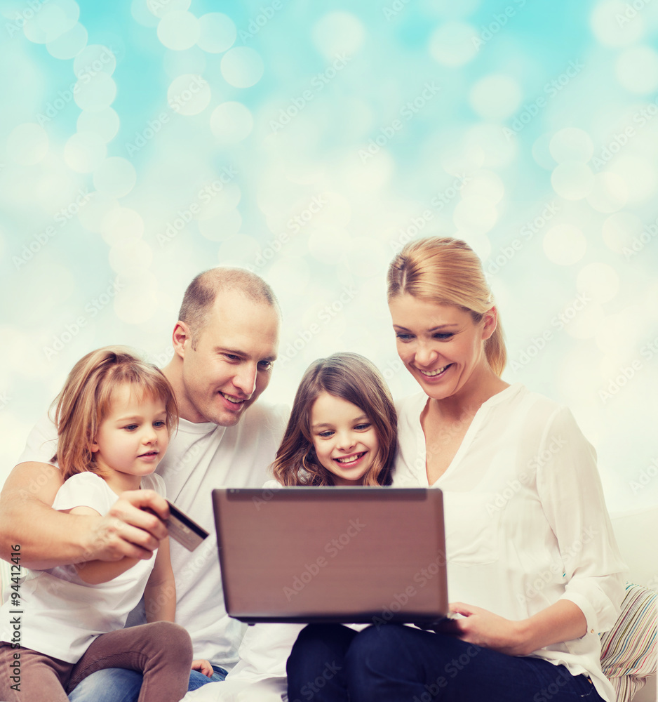 happy family with laptop computer and credit card happy family with laptop computer and credit card