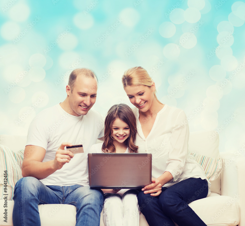 happy family with laptop computer and credit card happy family with laptop computer and credit card