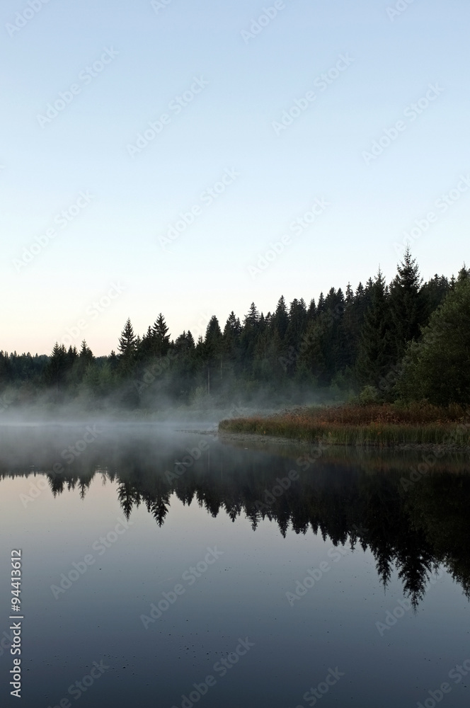 beautiful lake with mist early in the morning beautiful lake with mist early in the morning