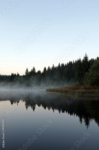 beautiful lake with mist early in the morning
