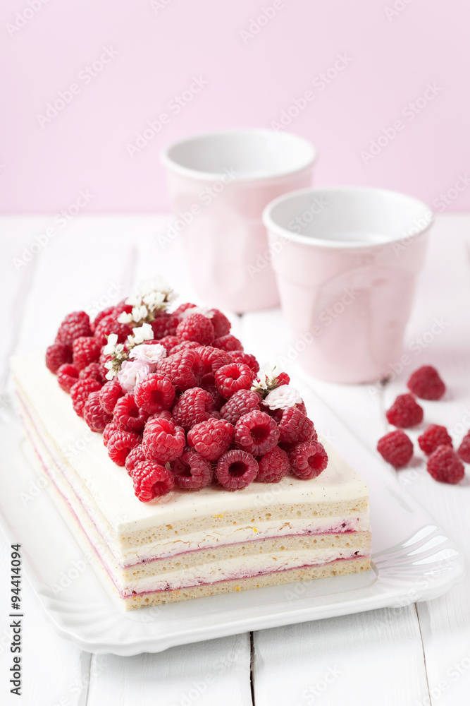 Green buckwheat cake with cream and fresh raspberries, selective focus Green buckwheat cake with cream and fresh raspberries, selective focus