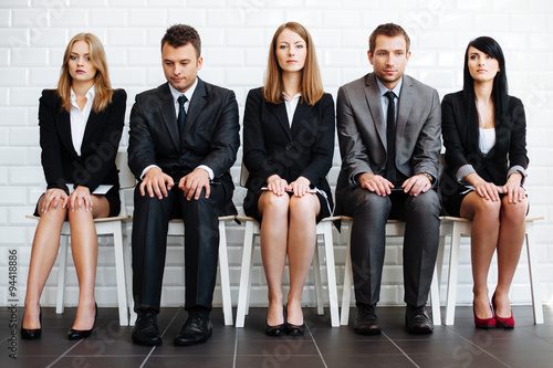 Stressed business people wiating for job interview photo